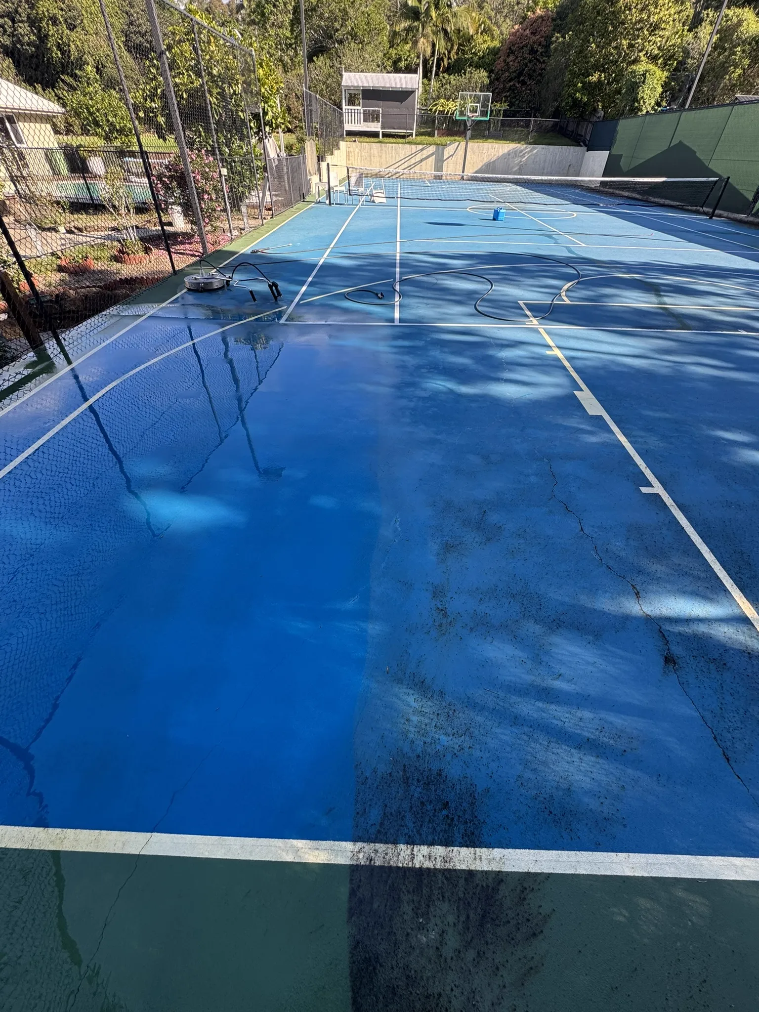 Tennis court half cleaned — dramatic dirty vs clean split